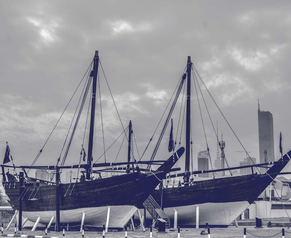 A traditional Kuwaiti dhow preserved in front of the city