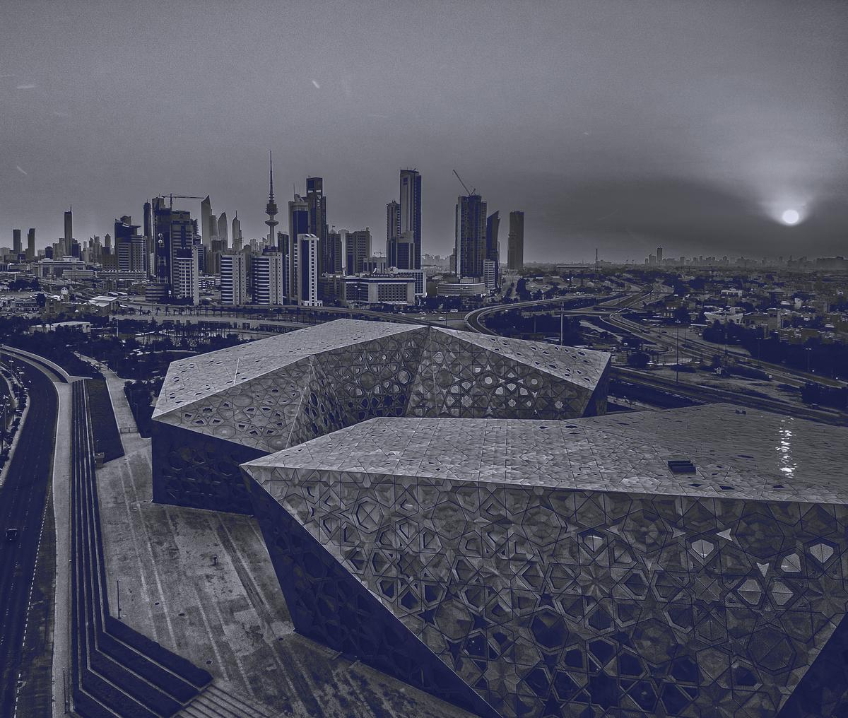 Kuwait City skyline at dusk, with the Sheikh Jaber Al-Ahmad Cultural Centre in the foreground