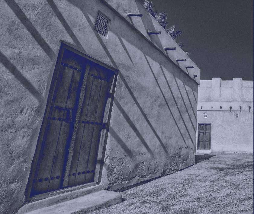 A traditional Kuwaiti mud-brick wall and timber door